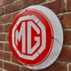 Red and white MG logo sign
