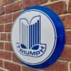 Side view of Triumph mild steel sign