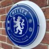 Handmade blue and white circular sign featuring the Chelsea Football Club badge.