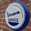 Handmade blue and white Vespa Service sign.
